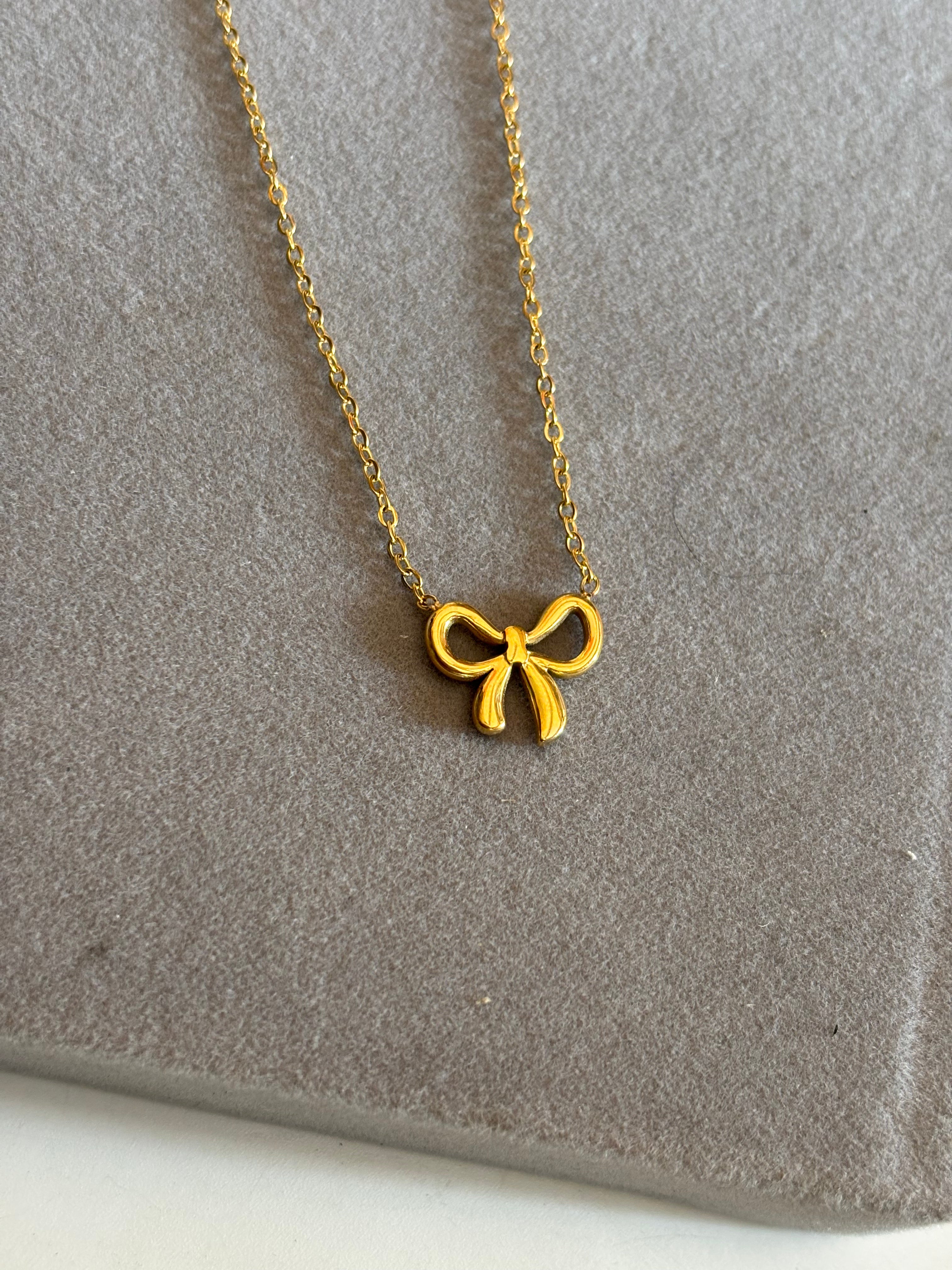 Solid bow necklace
