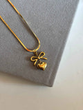 Bow with heart necklace - Hirulythings